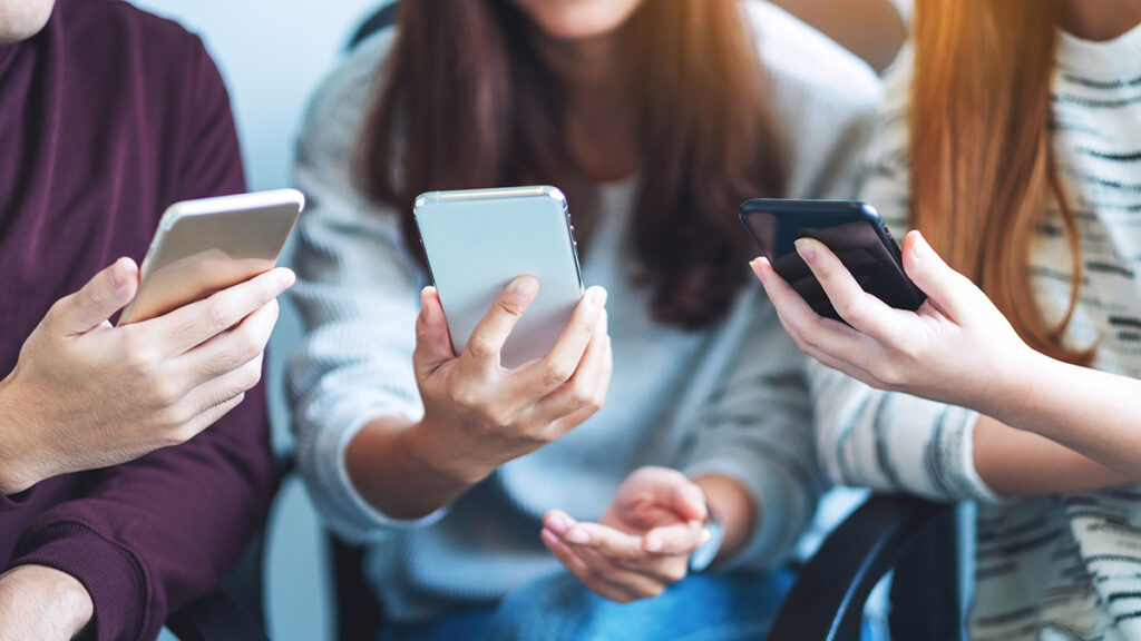 teenagers using smartphones
